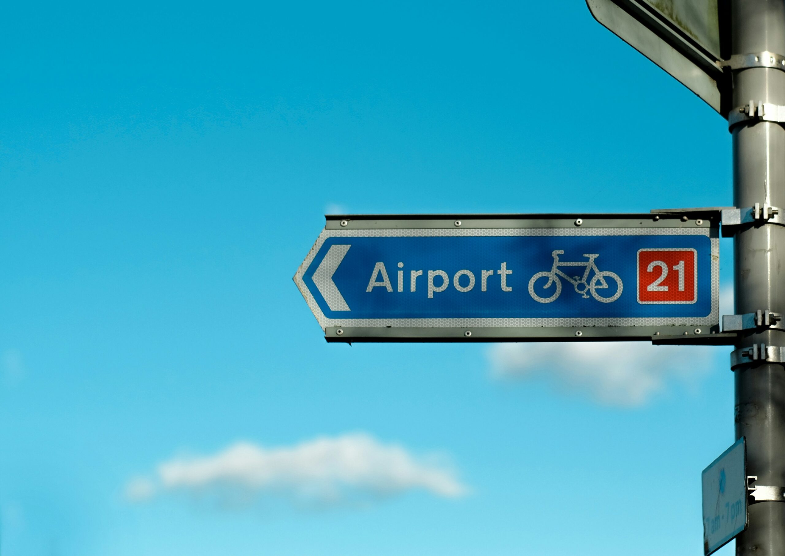 Private jet on airport runway during busy UK summer travel season for private jet planning.